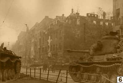 Soviet tanks on a street in Berlin/Public Domain